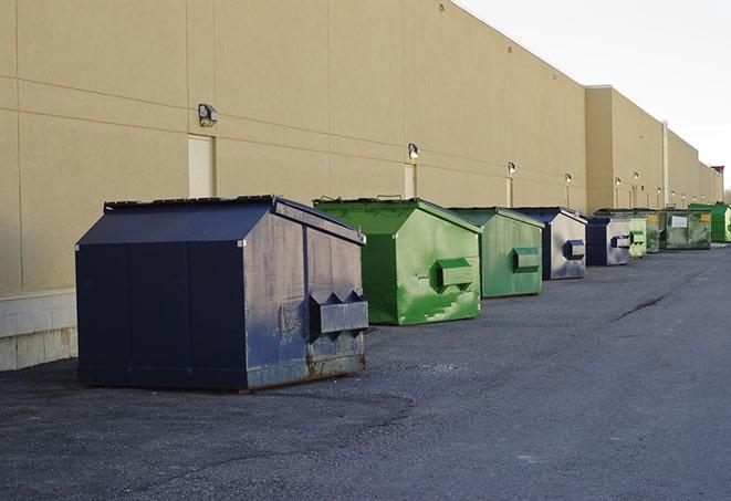 construction workers disposing of debris in large dumpsters in Bradbury CA